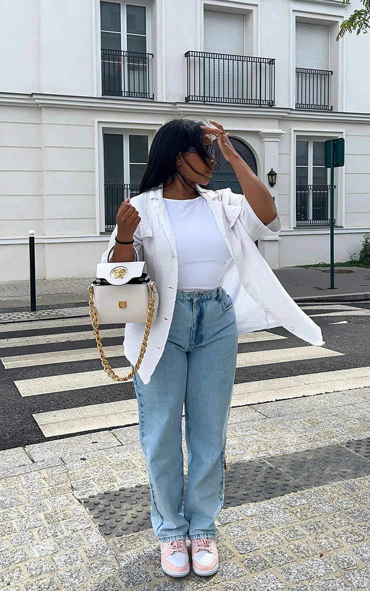 Light wash mom jeans are a versatile and trendy wardrobe essential that can be styled in numerous ways to create chic and fashionable outfits. 